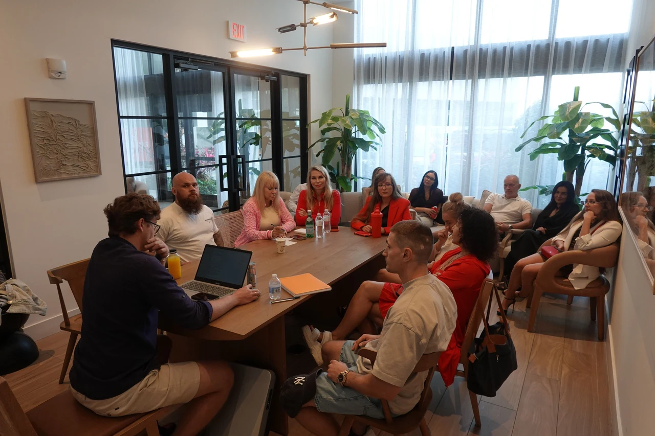Maxim leading a group health seminar around a table