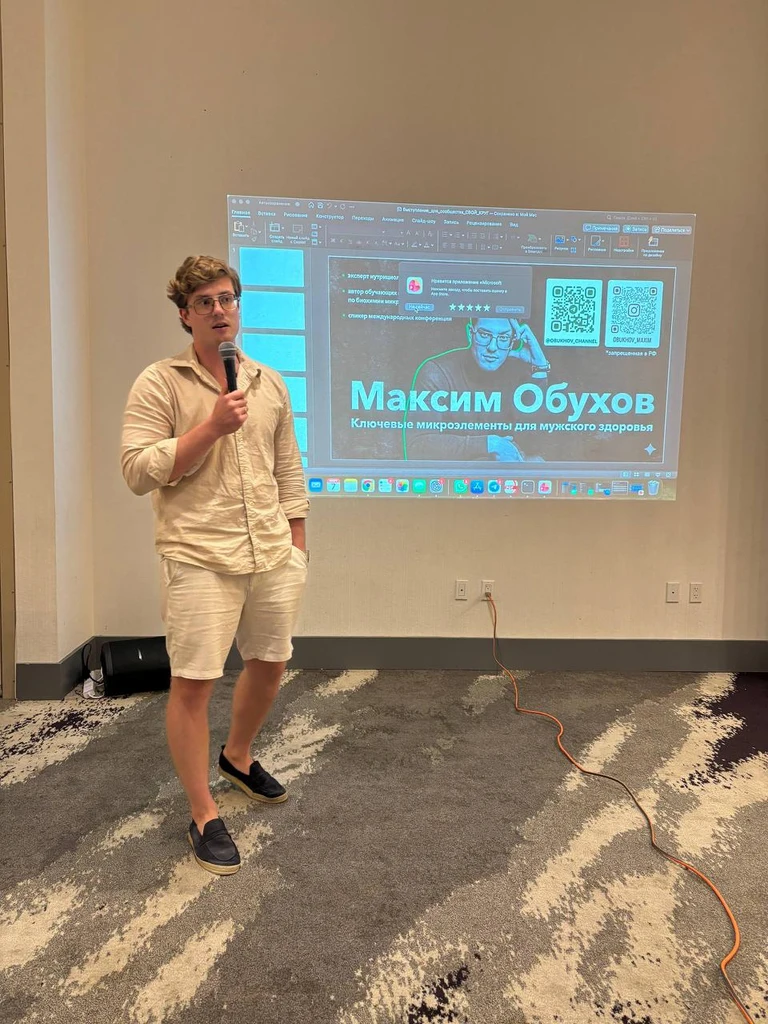 Maxim speaking at a conference on key microelements for men's health